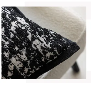 Macro shot of high-quality black and white textured bouclé fabric for pillow cover