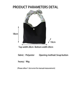Product dimensions of black patchwork tote bag featuring a decorative floral knot handle