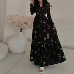 Full view of elegant black long sleeve floral maxi dress on model in studio