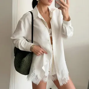 Elegant white oversized shirt set with delicate lace trim at the hem
