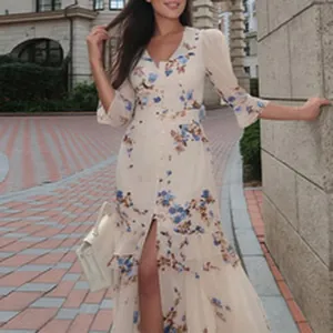 Detailed shot of a floral print maxi dress featuring elegant V-neck and high slit