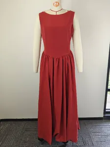 Elegant and sophisticated red sleeveless maxi dress with gathered waist on mannequin