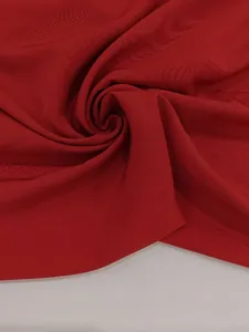 Macro view of high-quality breathable red sleeveless dress fabric texture and weave