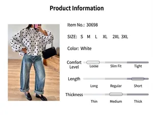 Detailed view of the stylish white polka dot loose-fit long-sleeve blouse.