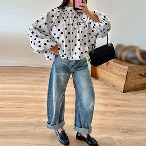 Women's fashionable oversized white long sleeve shirt featuring black polka dot patterns