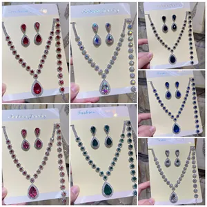 Detailed view of various colored rhinestone necklace, earring, and bracelet sets.