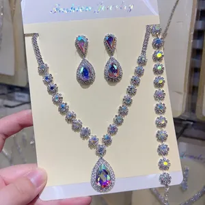 Close-up detail of 3-piece silver AB rhinestone necklace, earrings, and bracelet set.