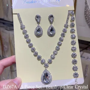 Detailed view of silver-tone teardrop crystal necklace earring and bracelet jewelry set