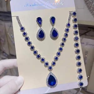 High quality macro view of sparkling blue rhinestone necklace and earring jewelry set