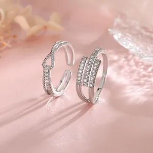 Exquisite silver geometric open rings featuring sparkling cubic zirconia in knot and spiral designs