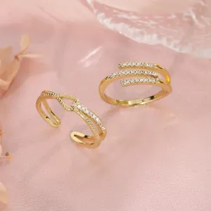 Elegant gold-plated geometric open rings with pavé stones featuring knotted and wrap designs