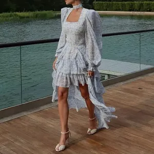 Elegant blue floral resort dress with long puff sleeves and asymmetrical high-low hem.