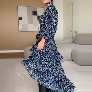 Detailed view of an elegant navy blue floral ruffled maxi dress for summer vacations