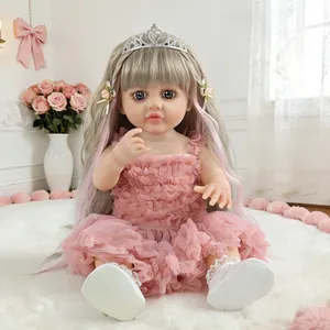 Realistic reborn baby doll in pink ruffled dress with tiara and cute white shoes.