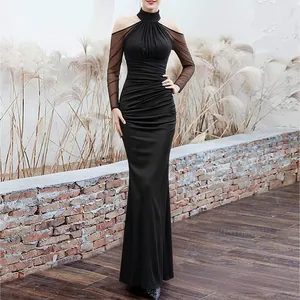 Elegant slim fit black halter floor-length dress with sheer sleeves and ruched waist.