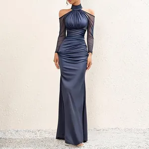 Elegant navy blue floor-length evening gown featuring mesh sleeves and ruched detail