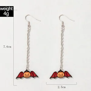 Detail view of Halloween bat pumpkin earrings with 7.6cm length and 4g weight specs.