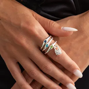 Stylish silver irregular fold rings set with colorful stones and a unique lock charm