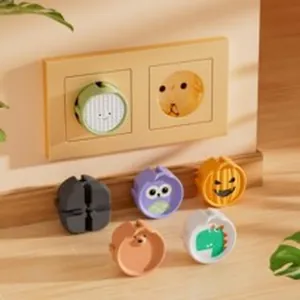 Assorted cartoon animal electrical outlet safety covers for baby proofing in home