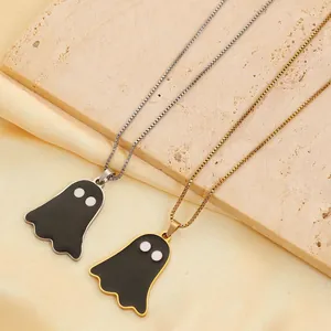 Close-up of minimalist stainless steel ghost necklaces in gold and silver finish.