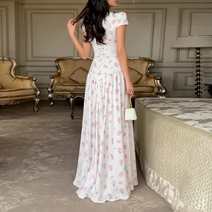 Detailed back view of an elegant white French maxi dress with pink rose floral print