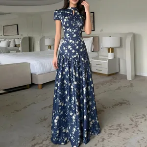 Full length of an elegant navy blue floral French dress with slim waist and high neck.