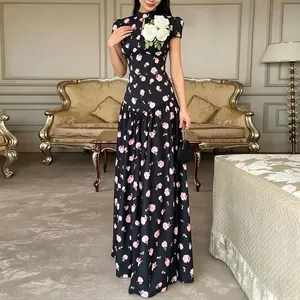 Elegant black French style maxi dress featuring pink floral print and white 3D flower applique