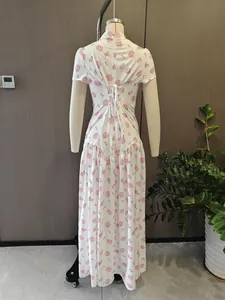 Back view of French floral print dress showing lace-up waist detail on mannequin