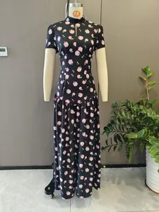 Detailed view of an elegant black floral maxi dress on a showroom mannequin