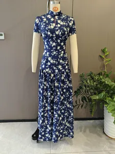 Detailed view of navy blue floral maxi dress with an elegant slim waist on mannequin