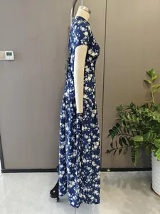 Detailed side view of a French style blue floral maxi dress displayed on a mannequin