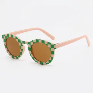 Fashionable retro checkerboard pattern kids sunglasses with brown round lenses and UV protection
