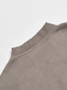 Detail of men's faux suede jacket collar with ribbed knit texture and taupe color