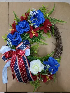Detailed view of a patriotic 45cm grapevine wreath with red white blue flowers and stars bow