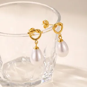 Elegant 18K gold-plated stainless steel heart knot earrings with white teardrop pearl drops