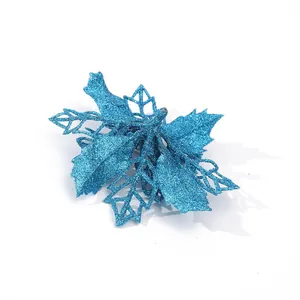 Detailed macro view of 9cm blue glitter hollow poinsettia flower for Christmas tree decor.