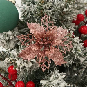 Macro view of a 9cm rose gold hollow glitter poinsettia flower for Christmas tree decor