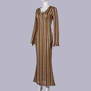Detailed view of the vibrant colorful zigzag pattern on a V-neck long sleeve maxi dress