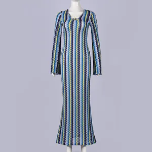 Full-length view of a slim fit V-neck long sleeve zigzag pattern knit maxi dress