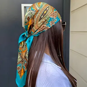 Elegant paisley print faux silk square scarf worn as a stylish headwrap