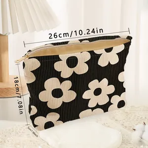 Corduroy floral makeup bag with dimensions 26x18x5cm and zipper closure.