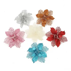 Glittery artificial poinsettia flowers in various vibrant colors for Christmas tree decorations