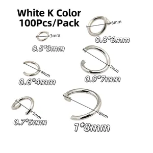 Detailed macro shot of silver-plated copper jump rings in assorted sizes from 3mm to 8mm
