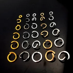 Detailed view of various sizes of gold and silver plated copper jump rings for DIY jewelry