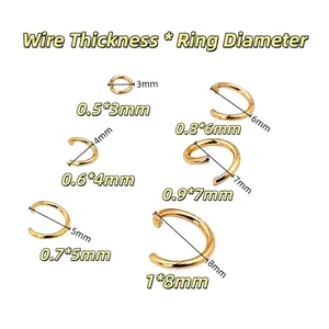 Detailed view of gold open jump rings in various sizes for DIY jewelry making.