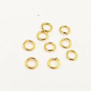 Detailed macro close-up of gold plated copper open jump rings for jewelry making