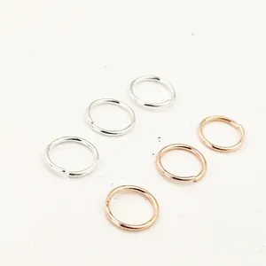 Close-up of copper jump rings for DIY jewelry making in silver and rose gold