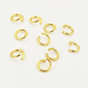 Detail view of golden plated copper open jump rings for DIY jewelry making and repair