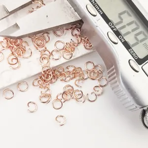 Macro view of 5mm rose gold copper open jump rings measured with a digital caliper