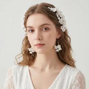Handcrafted white polymer clay floral bridal hair comb and matching earrings set for wedding
